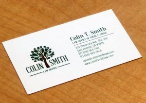 A business card for colin smith with a tree on it