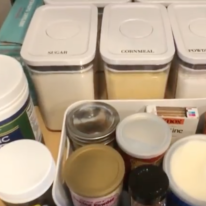 A bunch of containers with one that says cornmeal on it