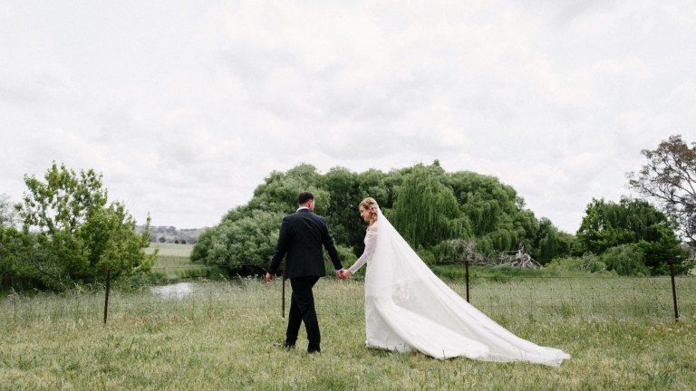 maison-de-challie-bride-white-structured-gown-with-partner-wide-shot