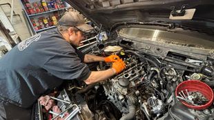 Our mechanic is working on the vehicle's engine in South Portland, ME | Ocean Street Auto Repair