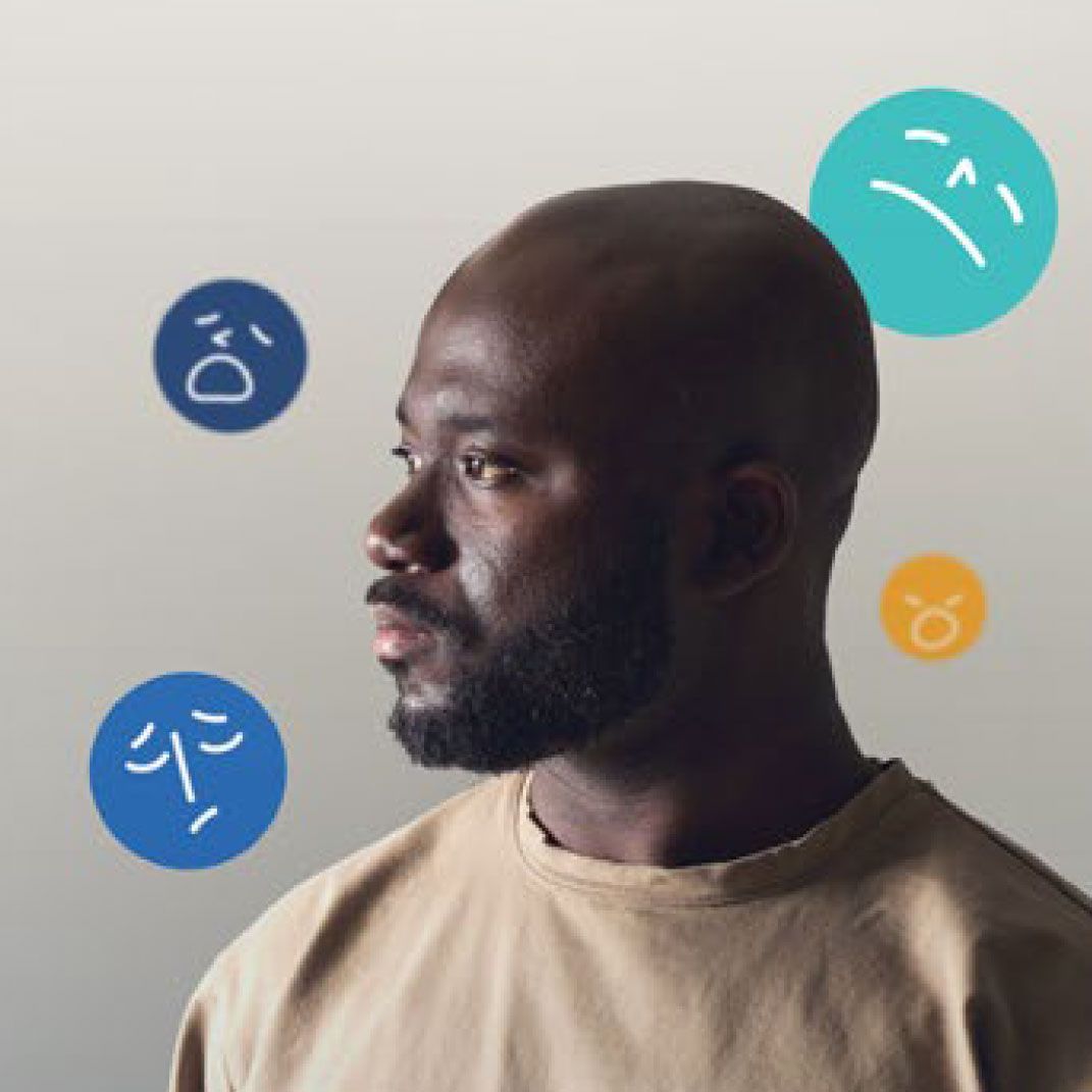 Man with a serious expression, surrounded by cartoon sad faces.