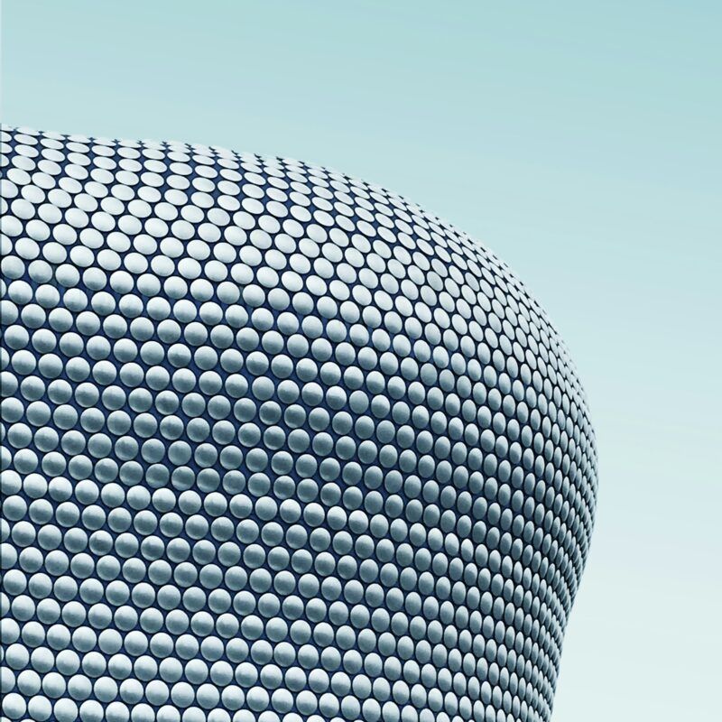 A close up of a building with a blue sky in the background.