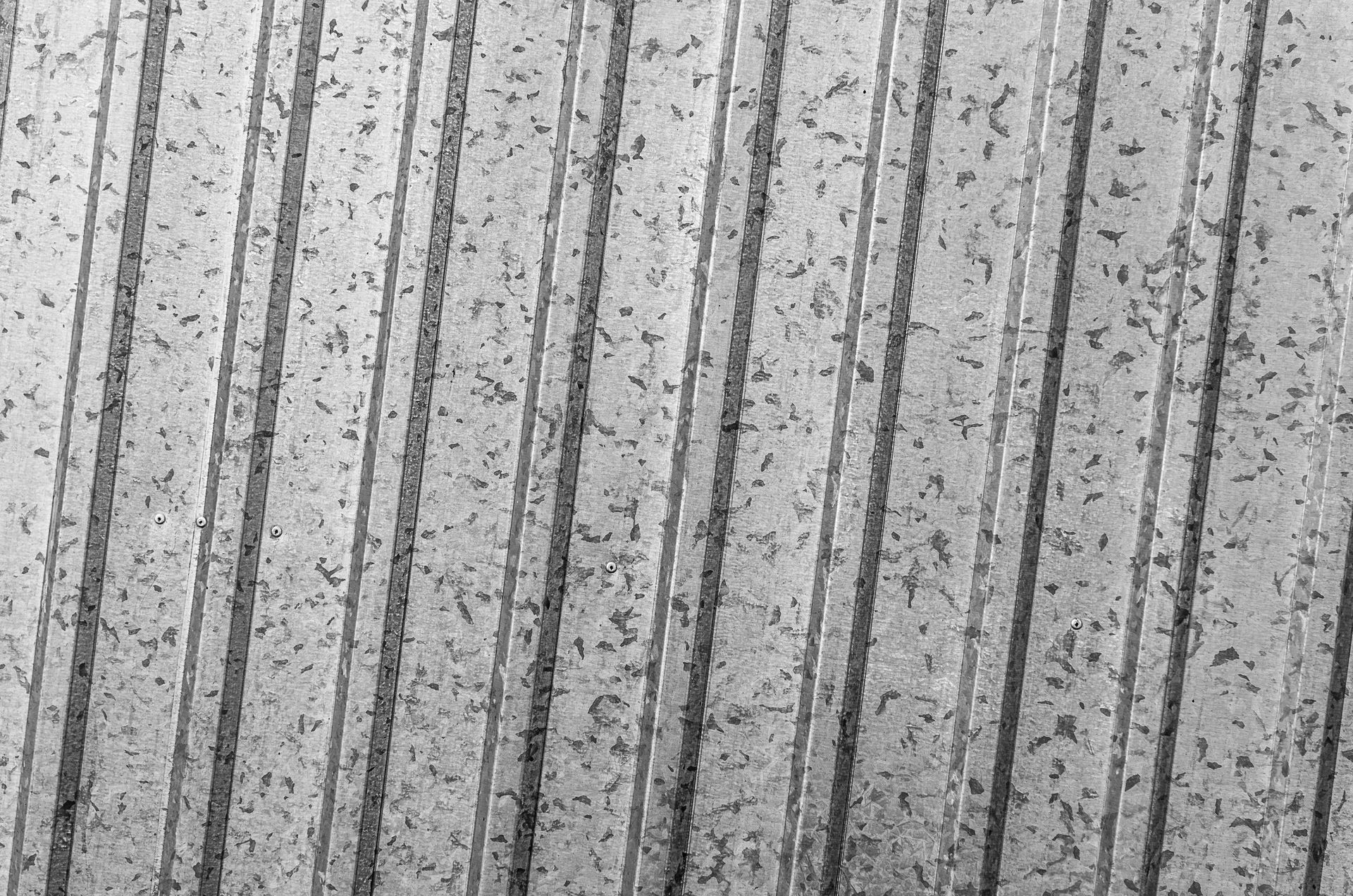 Textured gray surface with vertical lines.