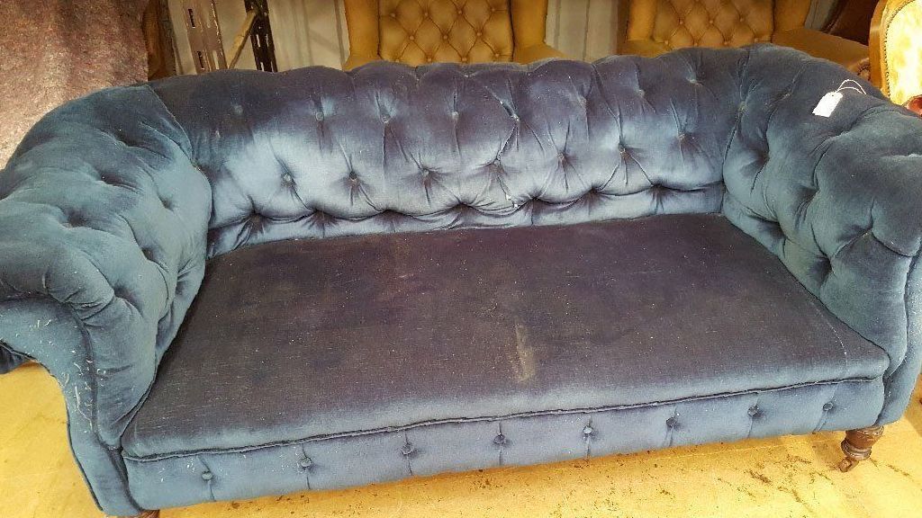 blue chesterfield faded Sofa before