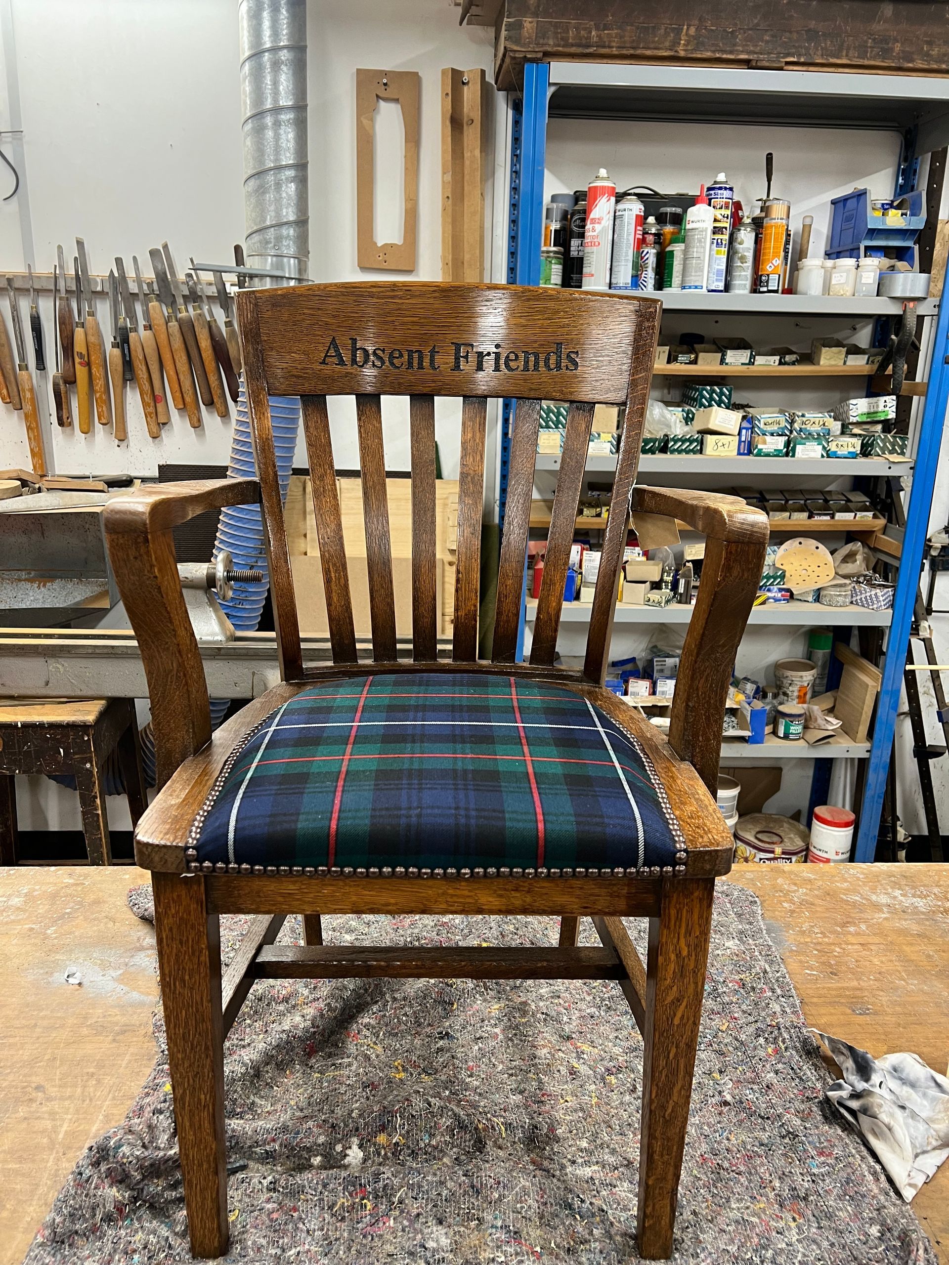 Absent Friends carved chair tartan seat