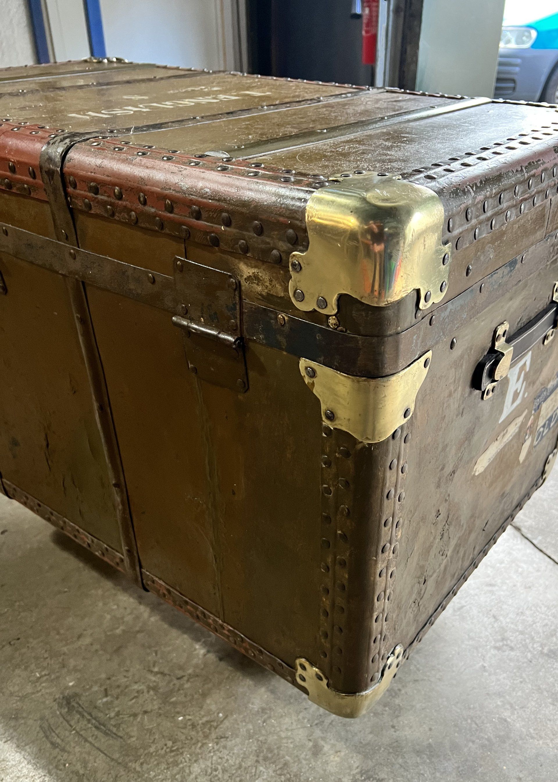 Antique trunk with polished brass corners after