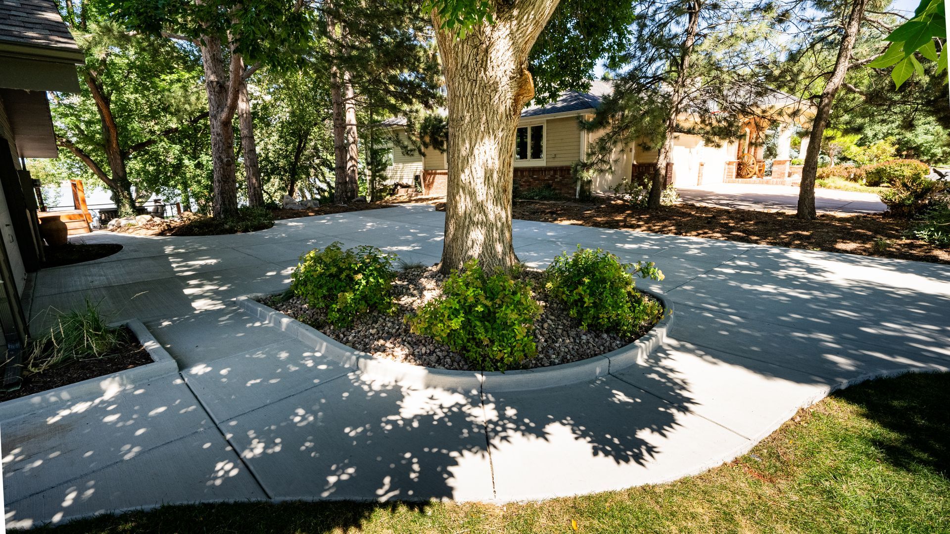 A walkway with grass and white gravel along the side of it.