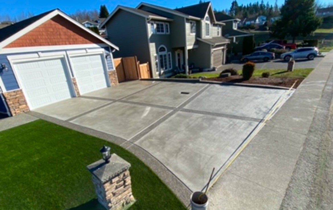 An aerial view of a driveway in front of a house.