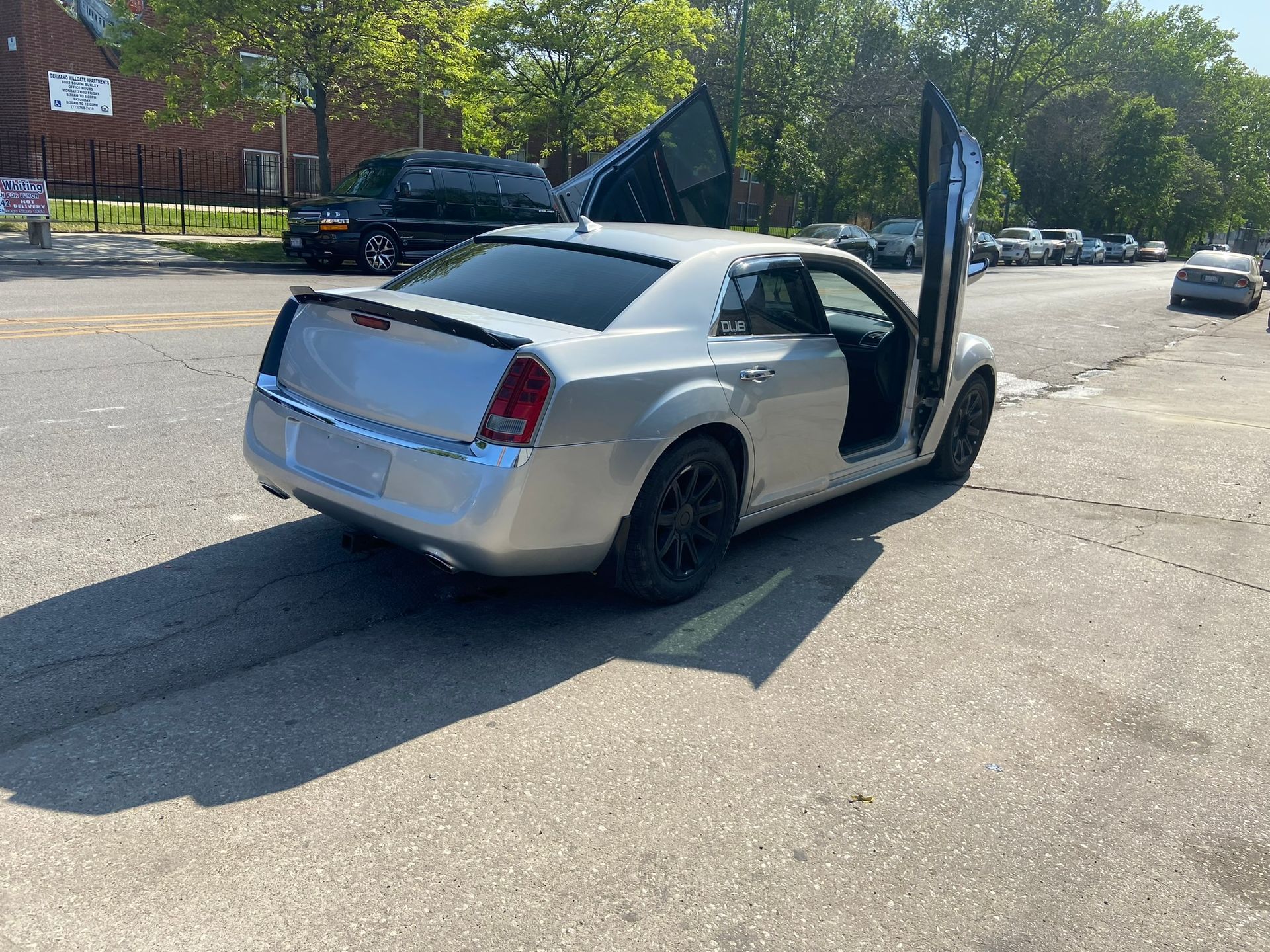 A Silver Car with The Door Open Is Parked on The Side of The Road — Chicago, IL — Ecuamex Autobody Inc.