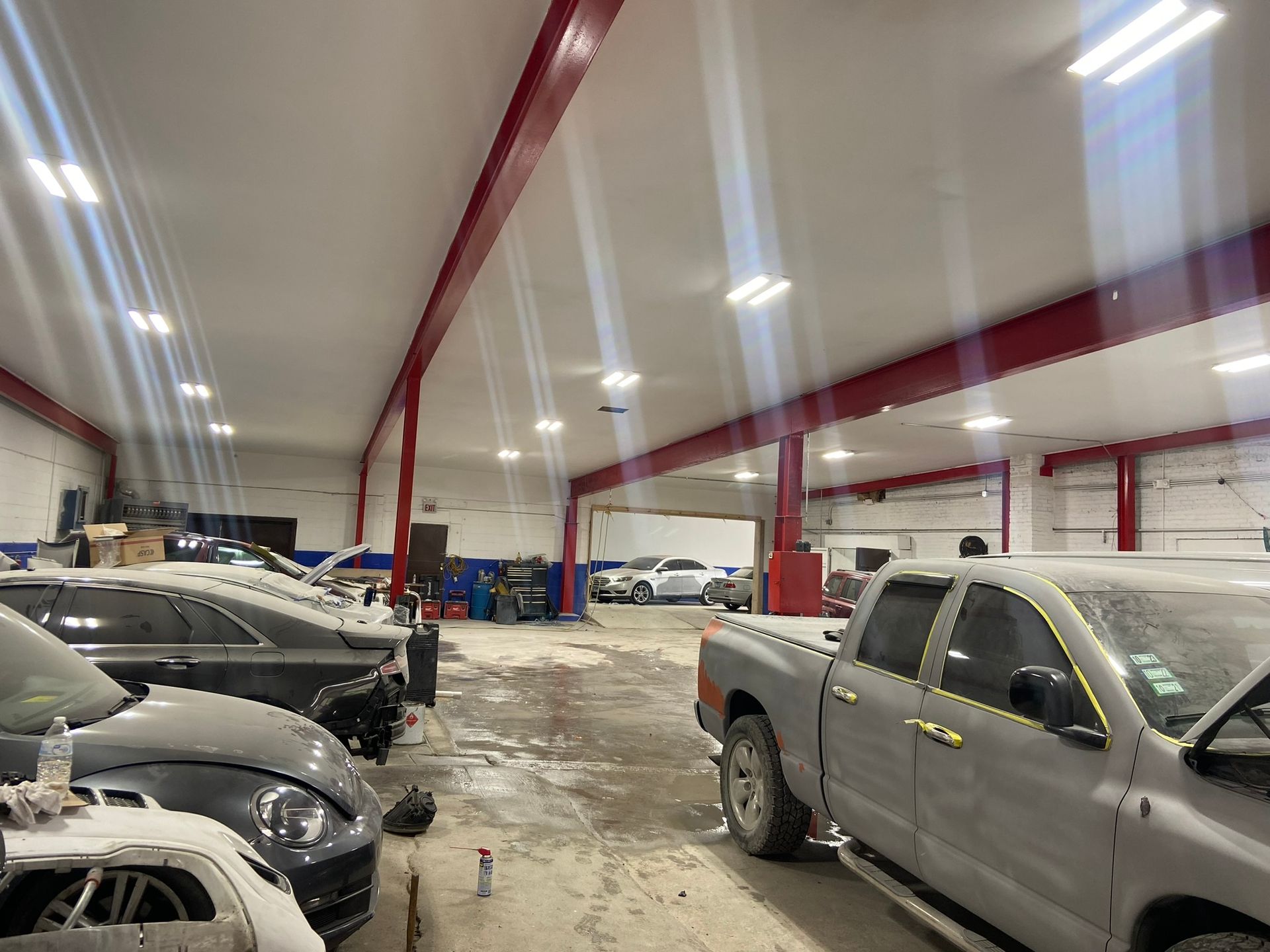 A Lot of Cars Are Parked in A Garage — Chicago, IL — Ecuamex Autobody Inc.