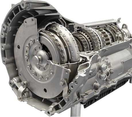 Cutaway view of a car automatic transmission, revealing internal gears, clutch plates, and housing. | Aus Tex Transmission