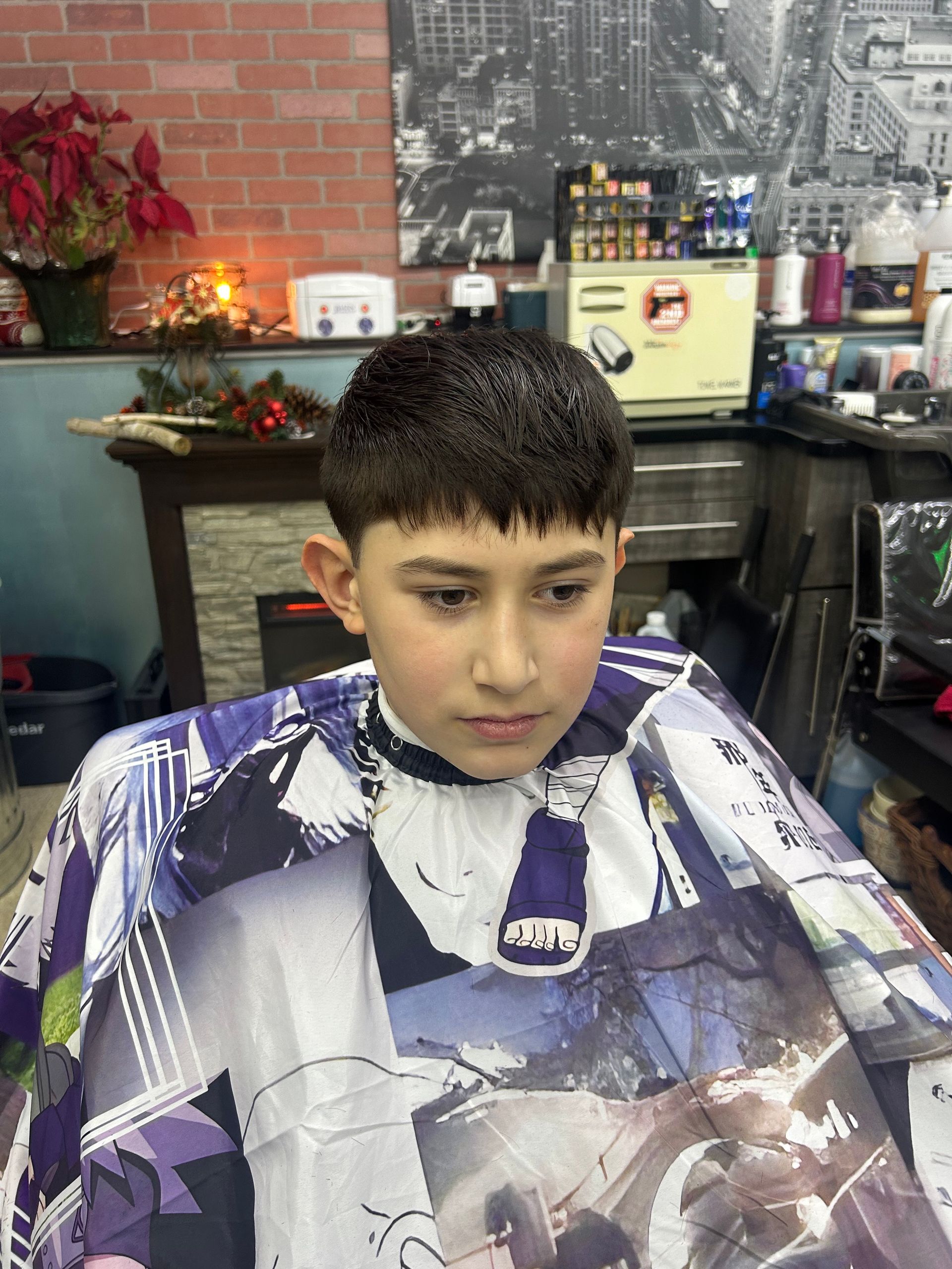 Barber trimming a man's beard with scissors. Close-up of beard, face, and hands holding scissors.