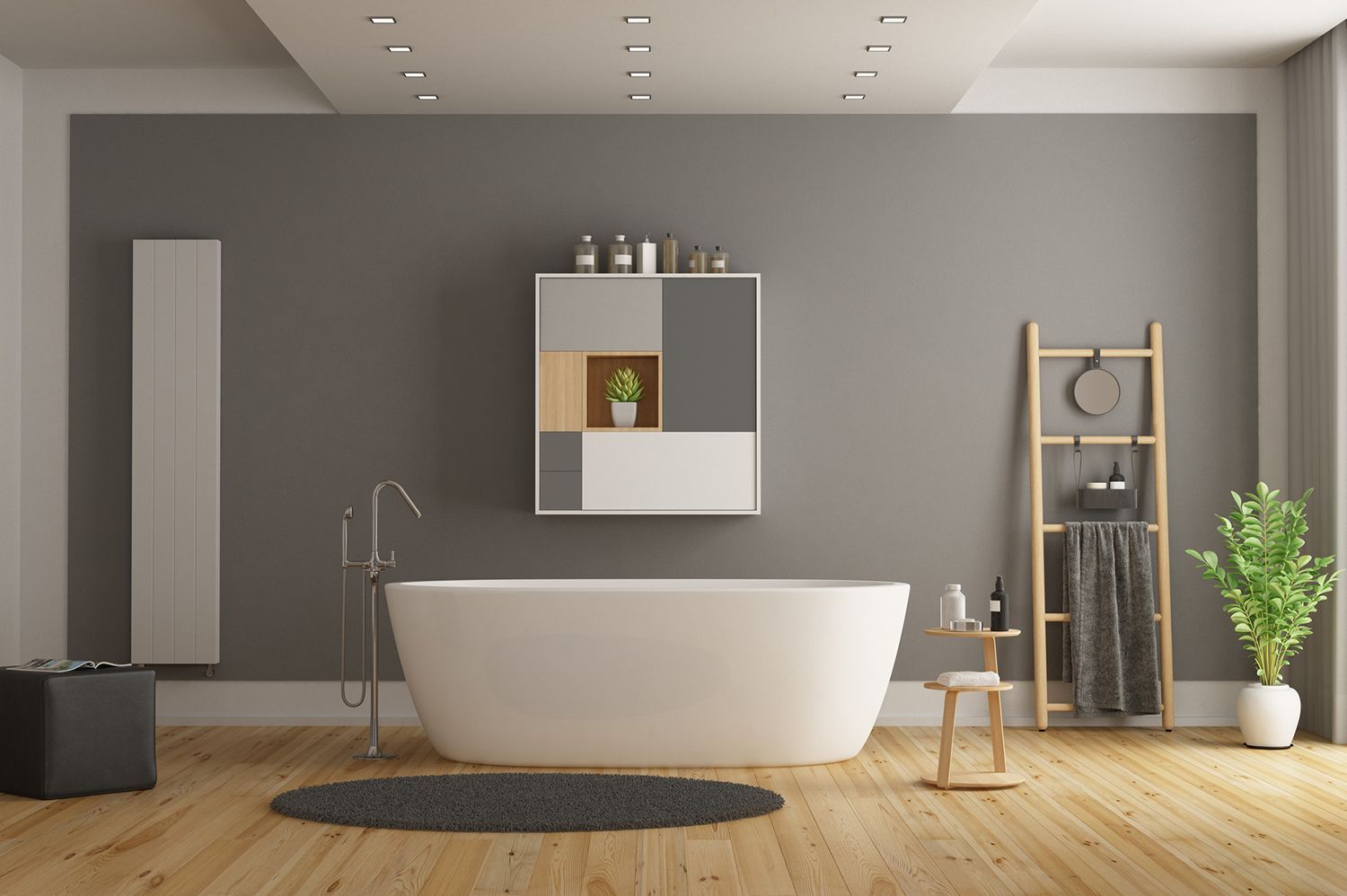 Modern bathroom with white tub, gray walls, and wooden accents.