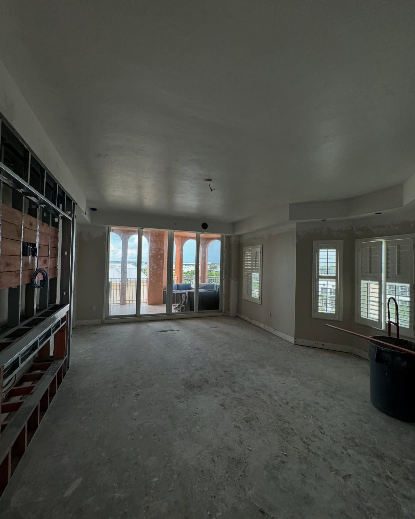 A large empty room with a lot of windows