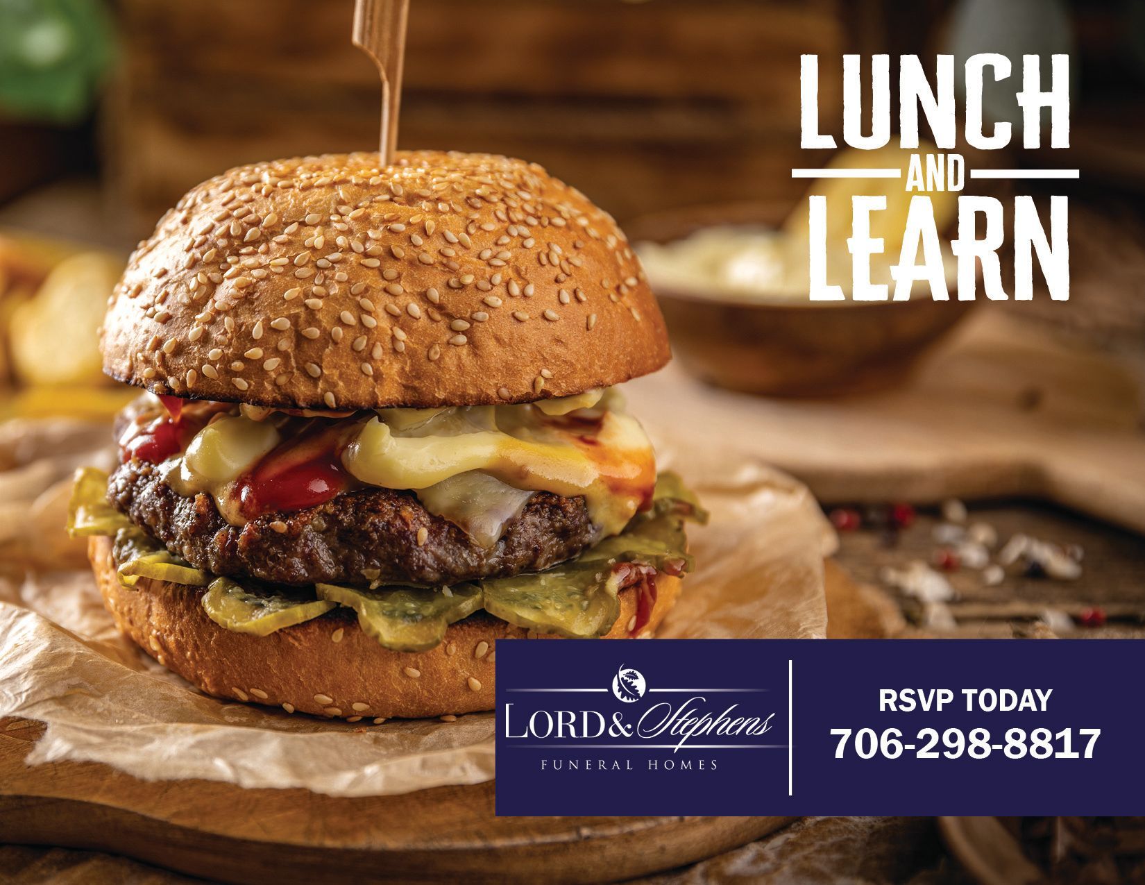 A hamburger is sitting on a wooden table with a toothpick sticking out of it.
