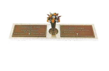 A grave with two plaques and a vase of flowers.