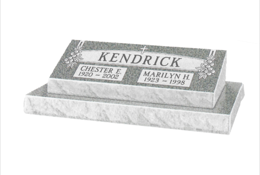 A black and white photo of a gravestone for kendrick