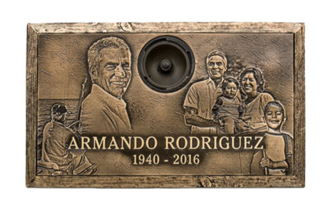 A bronze plaque with a picture of a family and the name armando rodriguez on it.