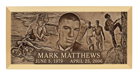 A grave marker for mark matthews with a picture of him