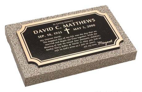 A grave marker for david c. matthews on a granite base
