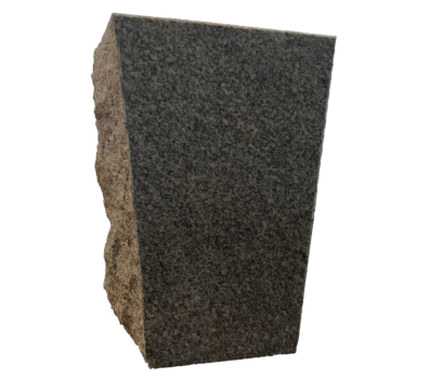 A piece of black granite is sitting on a white surface