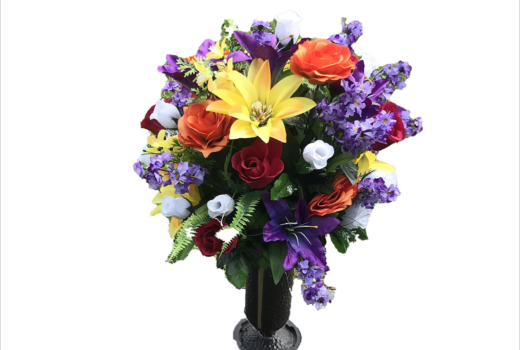 A vase filled with colorful flowers on a white background