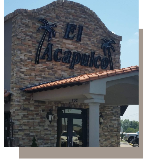 The exterior of El Acapulco restaurant featuring a stone facade, palm tree signage, and a tiled roof entrance.