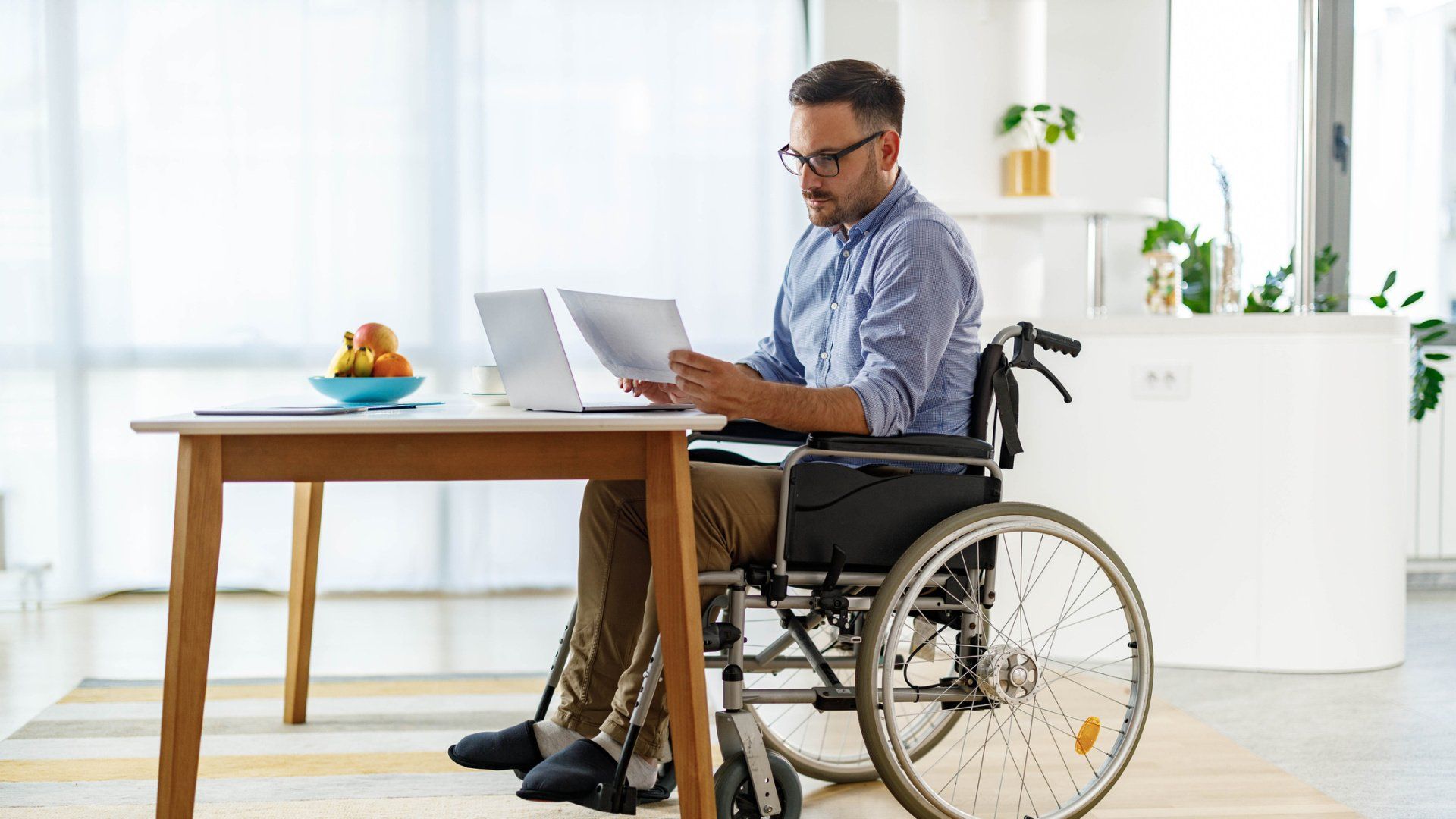 Disabled Businessman Reading Reports - Jonesboro, AR - Bartels, Sherman & Wallace