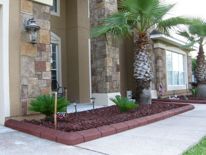 A house with a palm tree in front of it