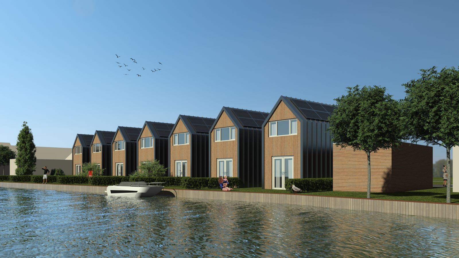 Een rij huizen naast een waterpartij