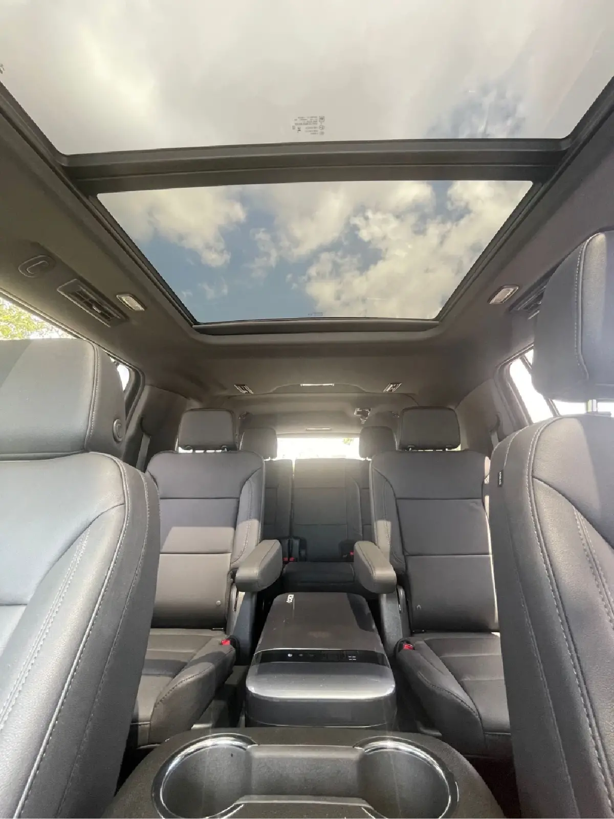 The inside of a car with a sunroof.