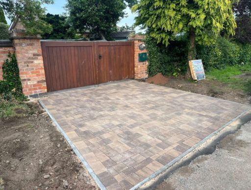 Close-up of speckled, light gray and black stone aggregate surface.