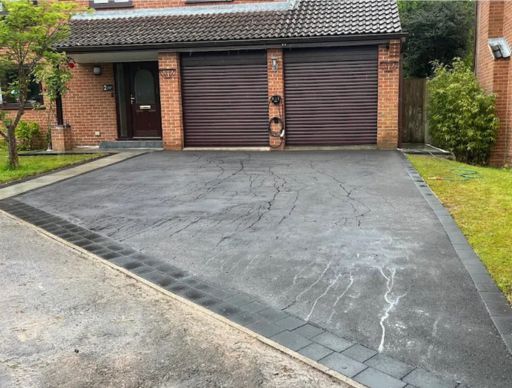 Close-up of a multi-colored aggregate, featuring red, brown, yellow, and beige pebbles.