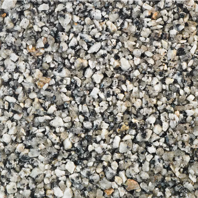 Close-up of speckled, light gray and black stone aggregate surface.