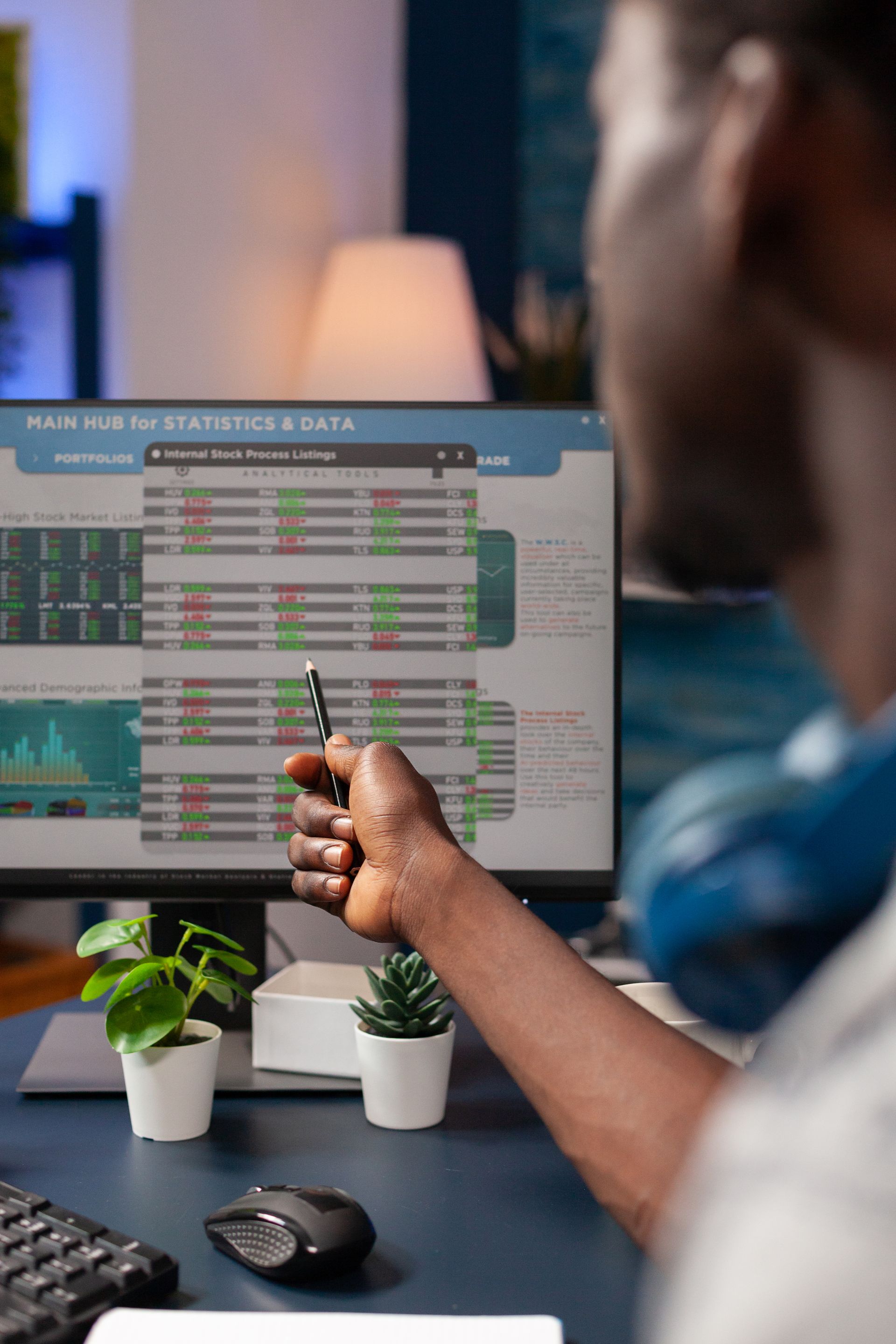 A young boy is sitting in the driver 's seat of a convertible car.