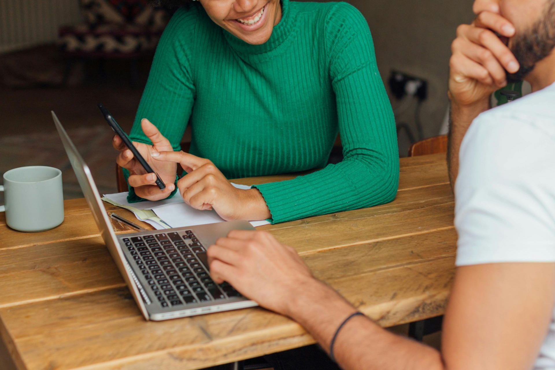 A row of brick buildings with trees on the side of the street