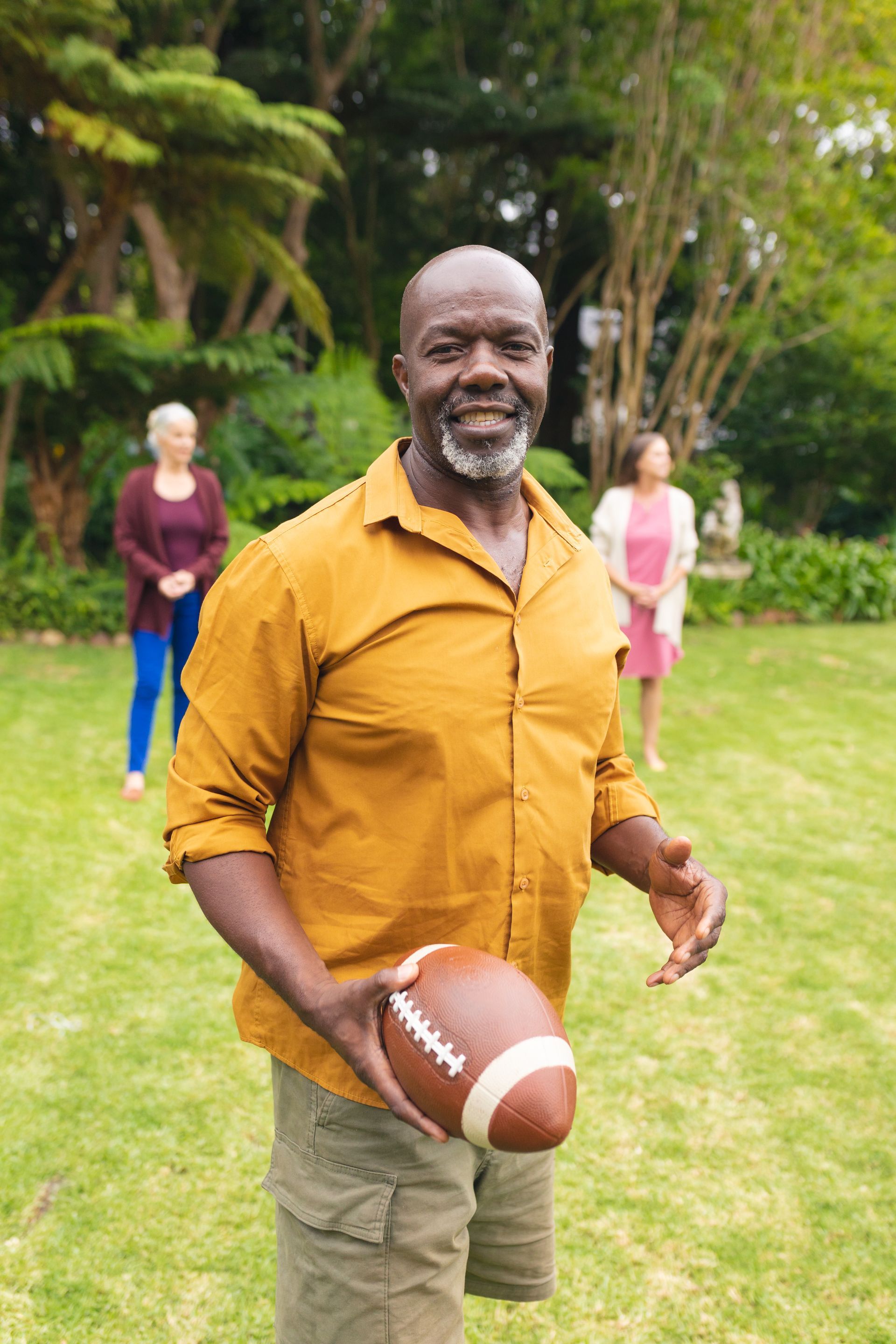 A young boy is sitting in the driver 's seat of a convertible car.