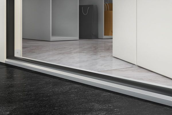 A close up of a door with a sliding glass door in a room.