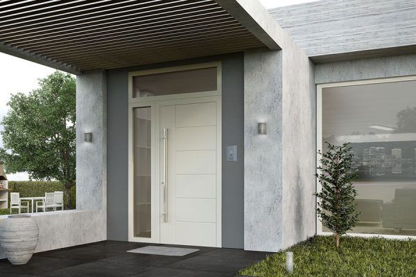 A modern house with a large white door and a large window.