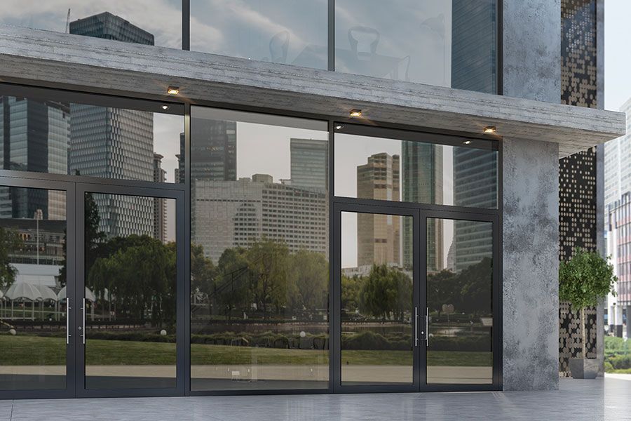 A large building with a lot of windows and doors.