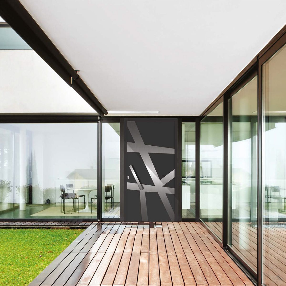 A house with lots of windows and a wooden deck