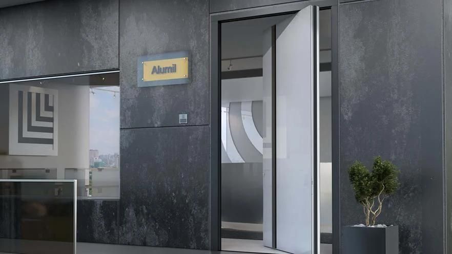 A door is open in a room with a plant in front of it.