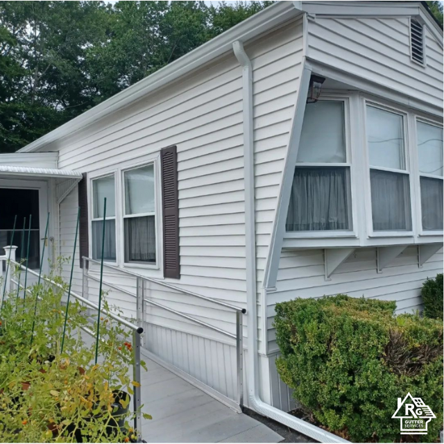 A white house with a ramp leading up to it