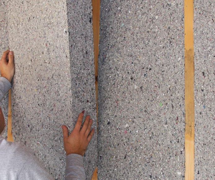 A building under construction with a red roof