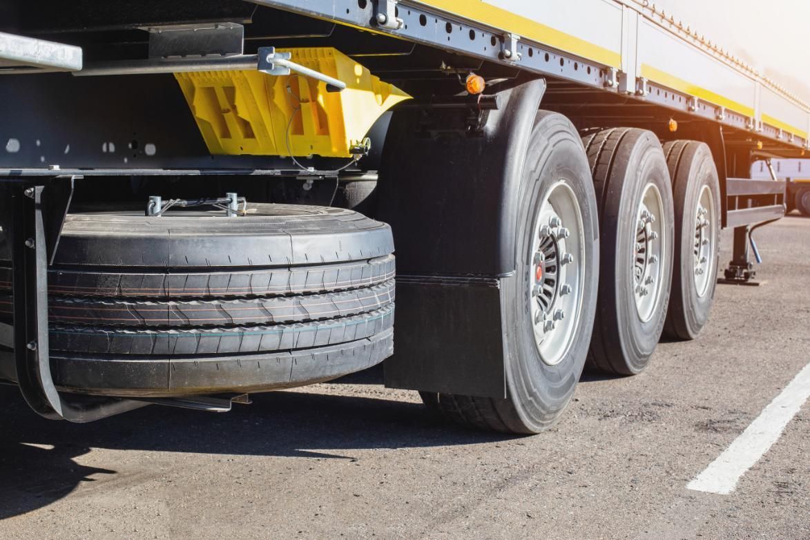 A Semi Truck Is Parked on The Side of The Road — Petersen's Second Hand & New Tyres in Currajong, QLD