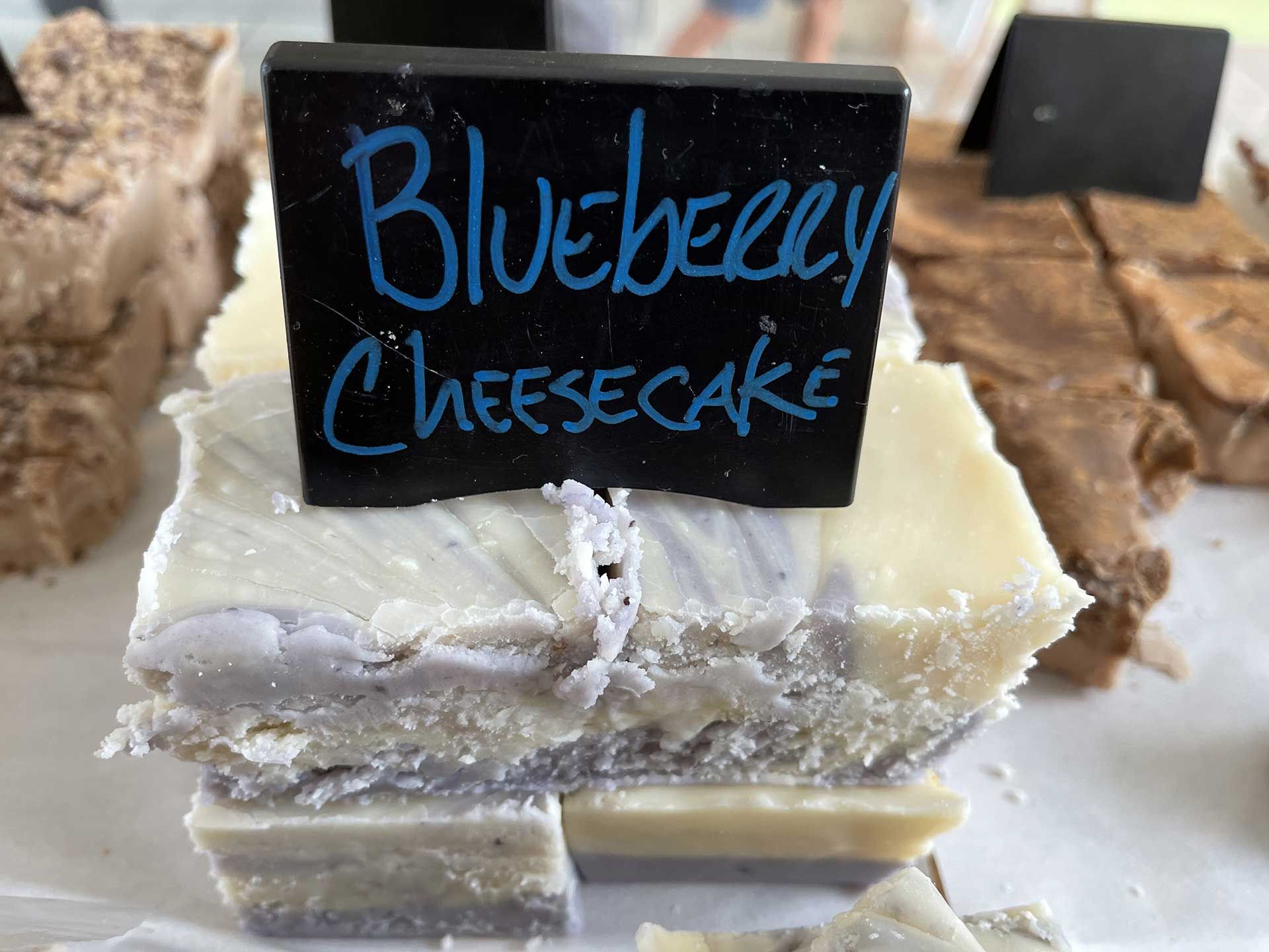 Blueberry cheesecake fudge with blue swirls, labeled