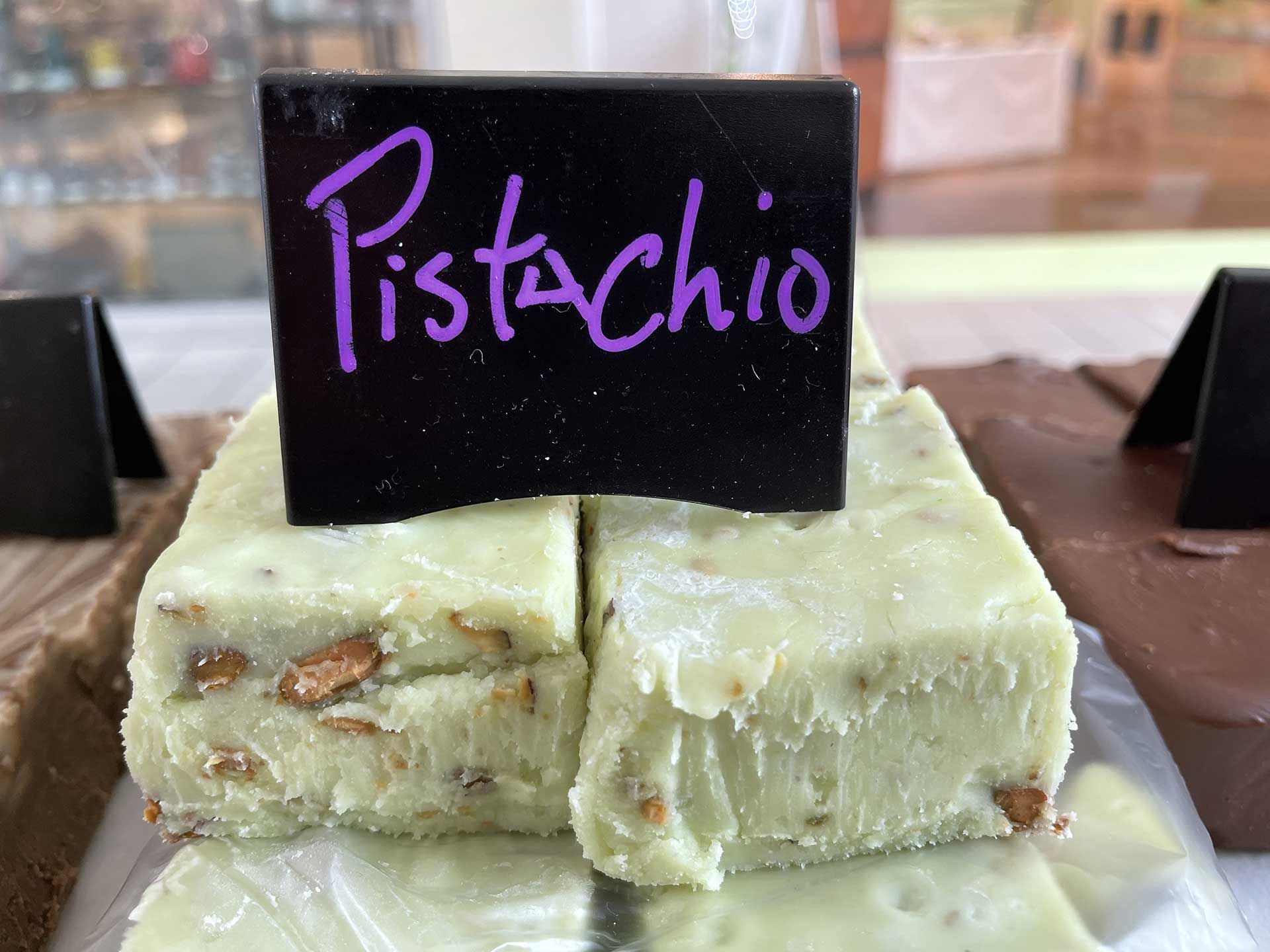 Pistachio fudge, light green with chopped nuts, labeled