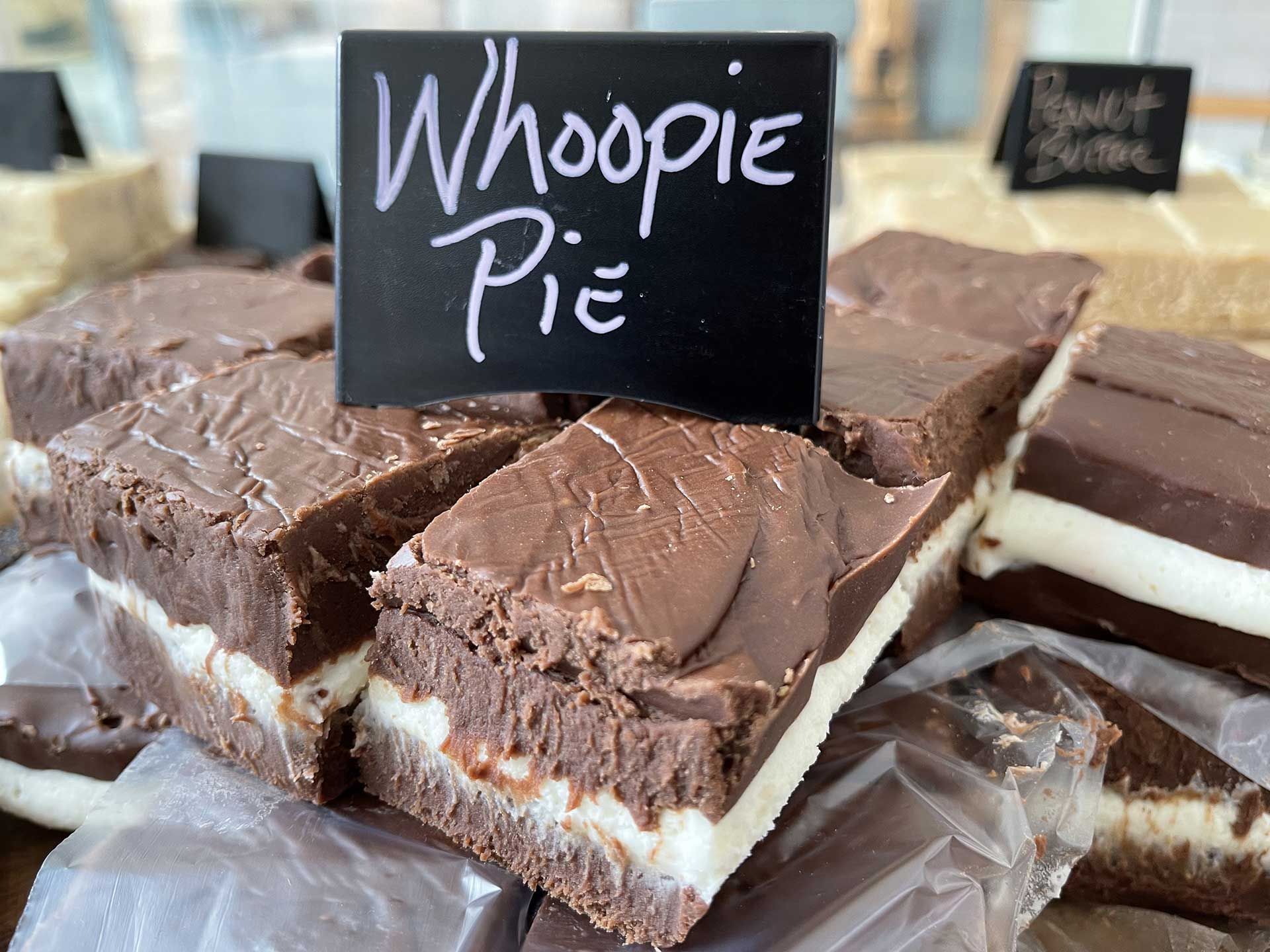Whoopie pie fudge slices, layered chocolate with white filling, labeled