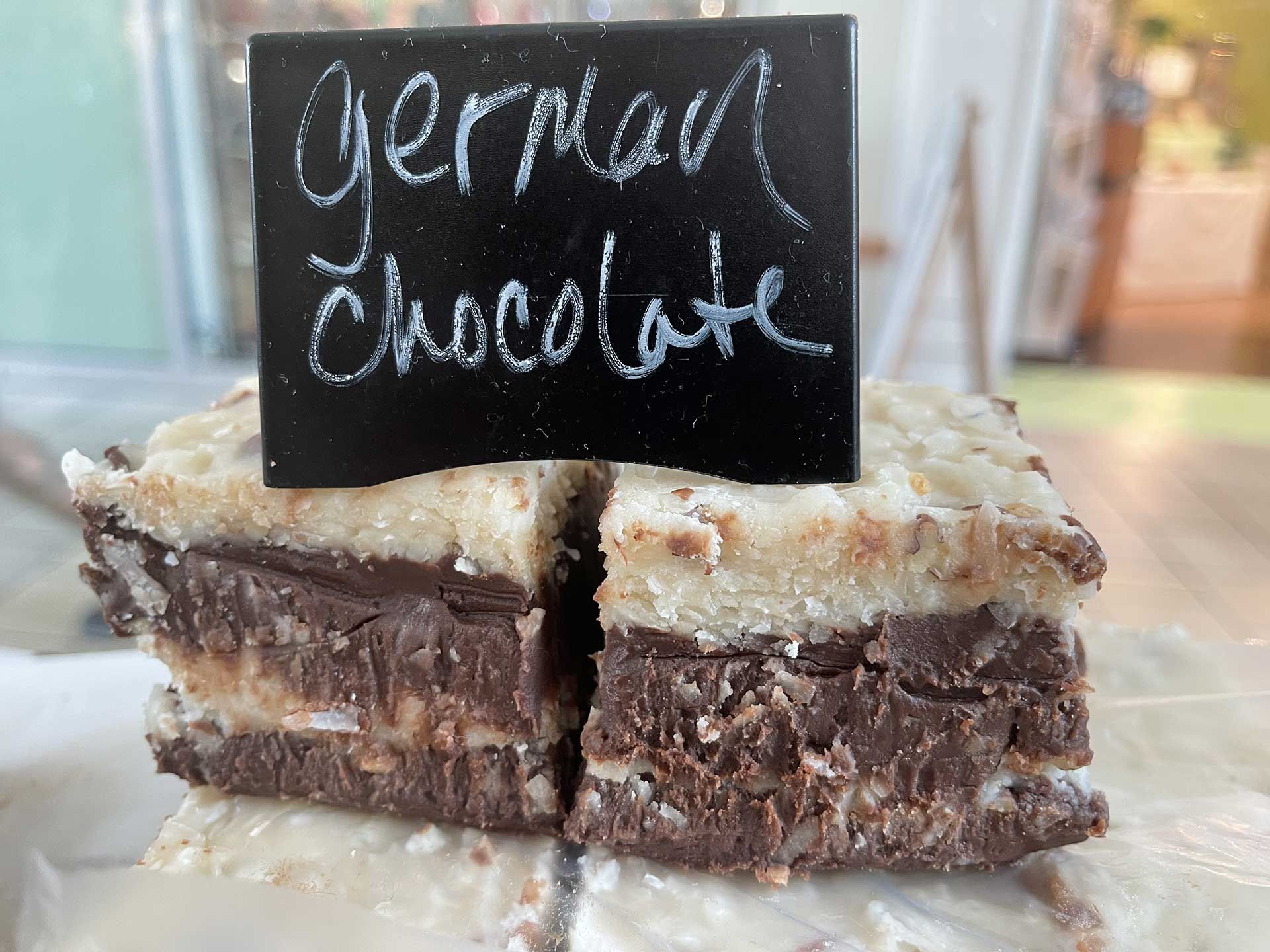 German chocolate fudge: chocolate and coconut layers, topped with sign that reads