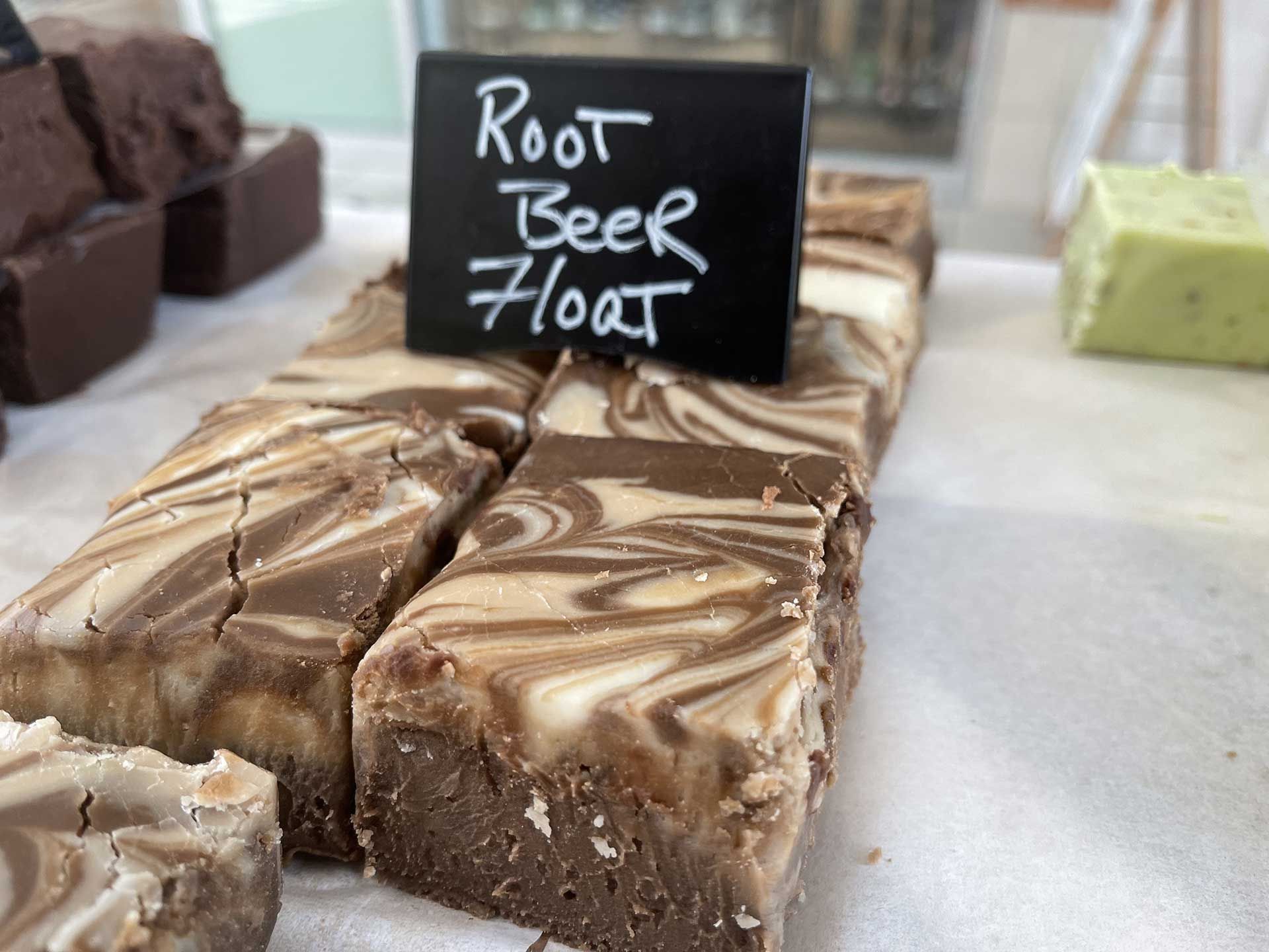 Root beer float fudge with a dark brown and cream swirl pattern, displayed on a white surface.